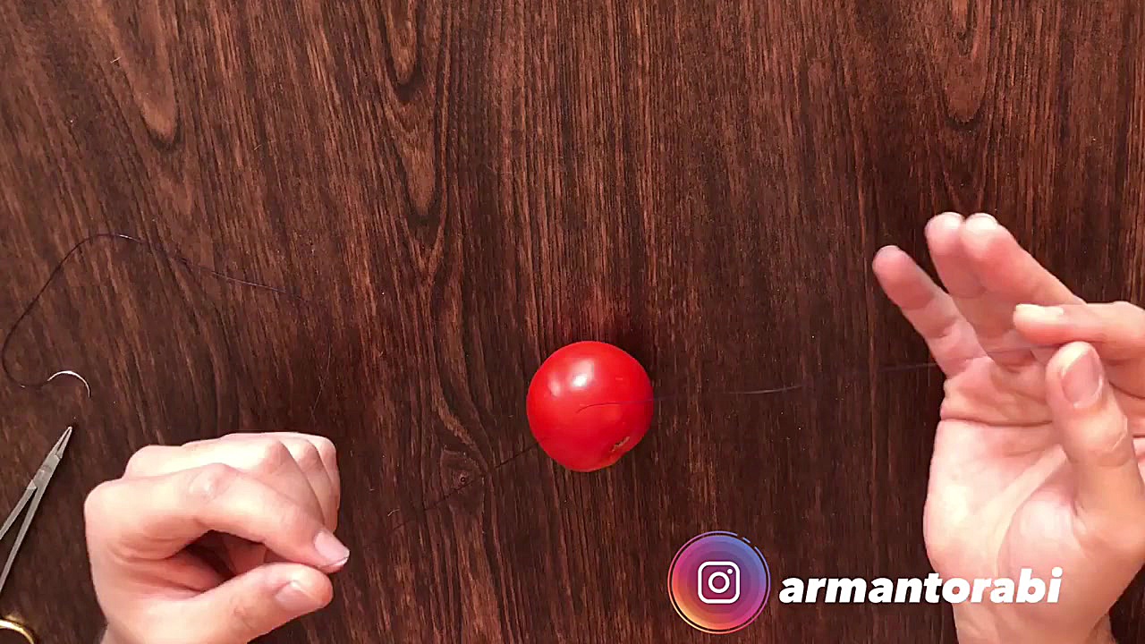 گره زدن بخیه با دست دکتر آرمان ترابی زاده متخصص جراحی دهان، فک و صورت