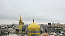 تعویض پرچم گنبد منور رضوی به م...