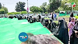 اهتزاز بزرگترین پرچم منقش به نام امیر المومنین (ع) در شهرستان ملارد اهتزاز بزرگترین پرچم منقش به نام امیر المومنین (ع) در شهرستان ملارد